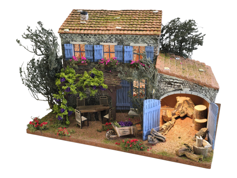Mise en scène de santons en argile et d’accessoires de crèche artisanaux inspirés des villages de Provence